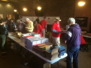 Volunteers prepare school materials for backpack stuffing at Lutheran Church of the Good Shepherd, Jan. 19, 2015